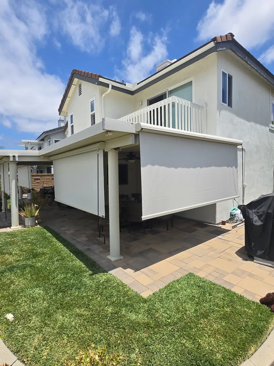 Motorized outdoor shade installed on a patio